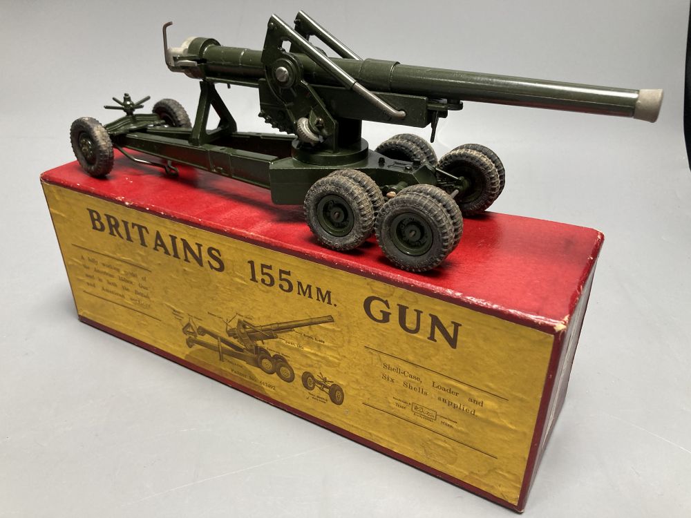 A Britains 155mm gun, with shell case, loader and six shells supplied, boxed, 30cm long